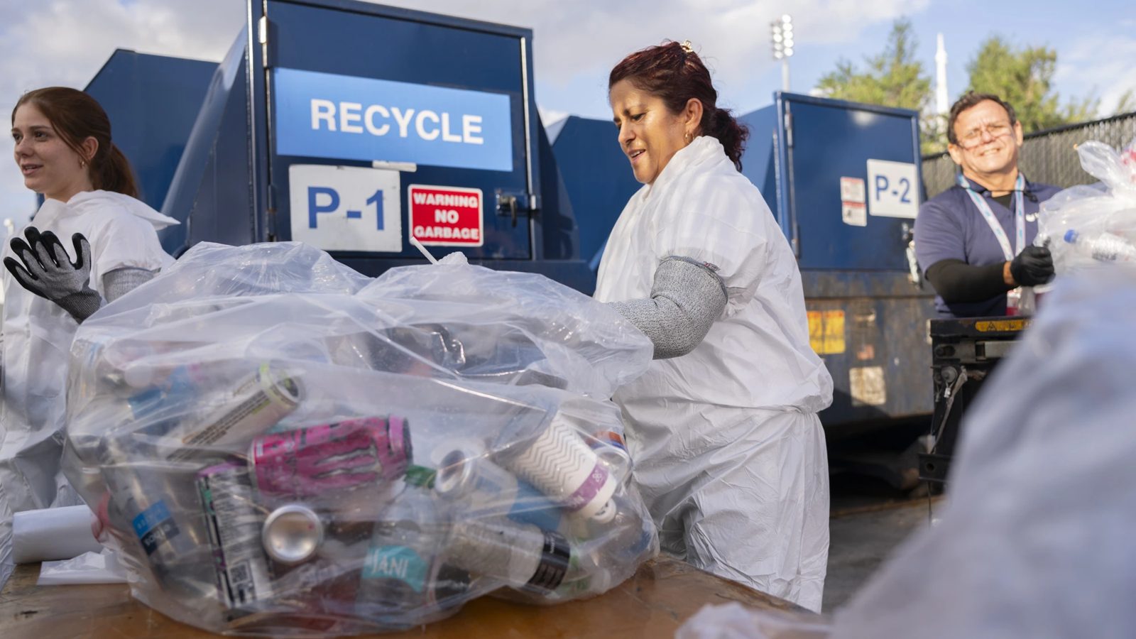 Mertel team sorting recycling at a stadium